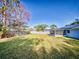 Large grassy backyard with wooden fence at 3220 Tamarind Dr, Edgewater, FL 32141