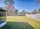 Spacious backyard with grassy area and wooden fence at 3220 Tamarind Dr, Edgewater, FL 32141