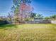 Large backyard with wooden fence at 3220 Tamarind Dr, Edgewater, FL 32141