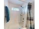 Bathroom with a shower/tub combo and a window for natural light at 3220 Tamarind Dr, Edgewater, FL 32141