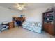 Home office with a desk, sofa, and bookcase at 3220 Tamarind Dr, Edgewater, FL 32141