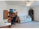 Home office with a sofa, desk, and storage at 3220 Tamarind Dr, Edgewater, FL 32141