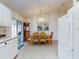 Bright dining room with wood table and chairs and hardwood floors at 3220 Tamarind Dr, Edgewater, FL 32141