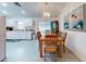 Dining area with a wood table and access to the kitchen at 3220 Tamarind Dr, Edgewater, FL 32141