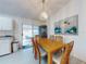 Dining area with a wood table and access to the kitchen at 3220 Tamarind Dr, Edgewater, FL 32141