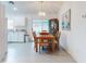 Dining room with a wood table and chairs, kitchen view at 3220 Tamarind Dr, Edgewater, FL 32141