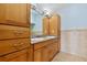 Bathroom with double vanity and wood cabinets at 3726 S Atlantic Ave, New Smyrna Beach, FL 32169