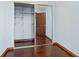 Mirrored closet with shelving and wood floors at 3726 S Atlantic Ave, New Smyrna Beach, FL 32169