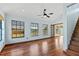 Hardwood floor bedroom with window and access to a deck at 3726 S Atlantic Ave, New Smyrna Beach, FL 32169