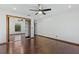 Bright bedroom with hardwood floors and mirrored closet at 3726 S Atlantic Ave, New Smyrna Beach, FL 32169