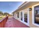 Red wooden deck with ocean views at 3726 S Atlantic Ave, New Smyrna Beach, FL 32169