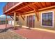 House exterior with red deck and double doors at 3726 S Atlantic Ave, New Smyrna Beach, FL 32169