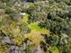 Aerial view of property showing home and surrounding trees at 384 W Ariel Rd, Edgewater, FL 32141