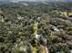 Aerial view of property showing home, outbuildings, and surrounding land at 384 W Ariel Rd, Edgewater, FL 32141