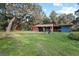 Rustic barn with covered stalls at 384 W Ariel Rd, Edgewater, FL 32141