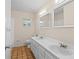 Bathroom with double vanity and terracotta tile floor at 384 W Ariel Rd, Edgewater, FL 32141