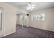 Bedroom with mirrored closet and carpet flooring at 384 W Ariel Rd, Edgewater, FL 32141