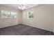 Bedroom featuring carpet flooring and large windows at 384 W Ariel Rd, Edgewater, FL 32141