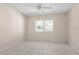 Spacious bedroom with tile floors and large window at 384 W Ariel Rd, Edgewater, FL 32141