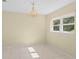 Simple dining room with chandelier and tile floors, plenty of natural light at 384 W Ariel Rd, Edgewater, FL 32141