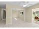 Bright dining room with chandelier and tile floors, adjacent to kitchen at 384 W Ariel Rd, Edgewater, FL 32141