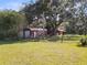 Metal building and barn with large yard at 384 W Ariel Rd, Edgewater, FL 32141