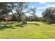 Open field with a red barn and lush greenery at 384 W Ariel Rd, Edgewater, FL 32141