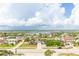 Aerial view of neighborhood, showcasing homes and waterway at 3851 S Atlantic Ave # 701, Daytona Beach Shores, FL 32118