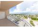 Balcony view with a white door and railing overlooking the city and waterways at 3851 S Atlantic Ave # 701, Daytona Beach Shores, FL 32118