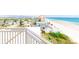 Balcony view overlooking the ocean, beach, and nearby houses at 3851 S Atlantic Ave # 701, Daytona Beach Shores, FL 32118