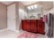 Bathroom with dark wood cabinets, granite countertop, and a separate shower at 3851 S Atlantic Ave # 701, Daytona Beach Shores, FL 32118