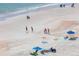 Beach scene with people relaxing and playing at 3851 S Atlantic Ave # 701, Daytona Beach Shores, FL 32118