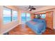 Ocean view bedroom with hardwood floors and large windows at 3851 S Atlantic Ave # 701, Daytona Beach Shores, FL 32118