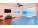 Spacious bedroom with ocean view and hardwood floors at 3851 S Atlantic Ave # 701, Daytona Beach Shores, FL 32118