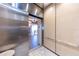 Stainless steel elevator with access to condo floors at 3851 S Atlantic Ave # 701, Daytona Beach Shores, FL 32118