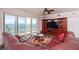 Living area features stunning ocean views and a large sectional sofa at 3851 S Atlantic Ave # 701, Daytona Beach Shores, FL 32118