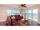 Living room boasts ocean views and a comfortable leather sectional at 3851 S Atlantic Ave # 701, Daytona Beach Shores, FL 32118