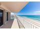 Spacious balcony with panoramic ocean views and white railings at 3851 S Atlantic Ave # 701, Daytona Beach Shores, FL 32118