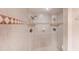 Large walk-in shower with tiled walls and dual shower heads at 3851 S Atlantic Ave # 701, Daytona Beach Shores, FL 32118