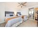 Bedroom with two twin beds and ceiling fan at 3855 S Atlantic Ave # 1105, Daytona Beach Shores, FL 32118