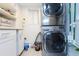 Laundry room with stacked LG washer and dryer at 3855 S Atlantic Ave # 1105, Daytona Beach Shores, FL 32118