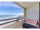 Balcony with ocean view and seating area at 3855 S Atlantic Ave # 1105, Daytona Beach Shores, FL 32118