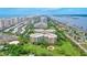 Aerial view of condo building showcasing ocean views and lush landscaping at 4 Oceans West Blvd # 502B, Daytona Beach, FL 32118