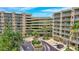 Aerial view of building, parking garage, and landscaping at 4 Oceans West Blvd # 502B, Daytona Beach, FL 32118