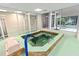 Relaxing hot tub with large windows offering natural light at 4 Oceans West Blvd # 502B, Daytona Beach, FL 32118