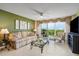 Living room with a view, neutral walls, and tiled floors at 4 Oceans West Blvd # 502B, Daytona Beach, FL 32118