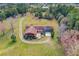 Aerial view of a ranch-style home on a large lot with mature trees at 4045 Jason St, New Smyrna Beach, FL 32168