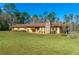 Ranch home with stone chimney and large yard at 4045 Jason St, New Smyrna Beach, FL 32168