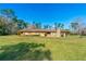 Ranch home with stone chimney and large yard at 4045 Jason St, New Smyrna Beach, FL 32168