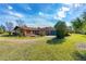 Ranch style home with a large yard and attached garage at 4045 Jason St, New Smyrna Beach, FL 32168